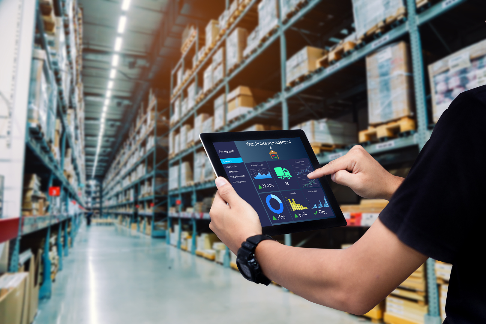 Man holding ipad warehouse